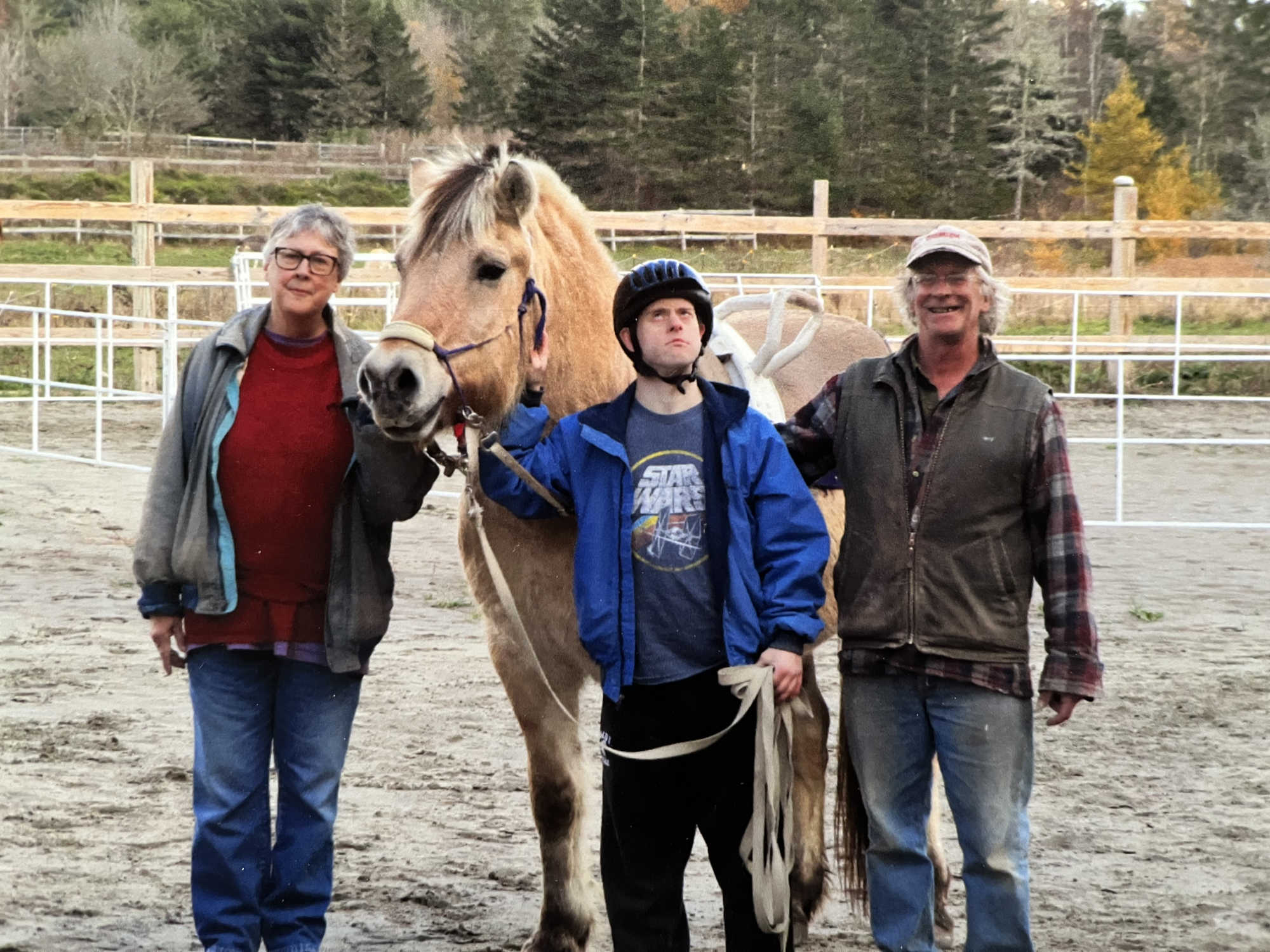 Rider and instructors leading horse.