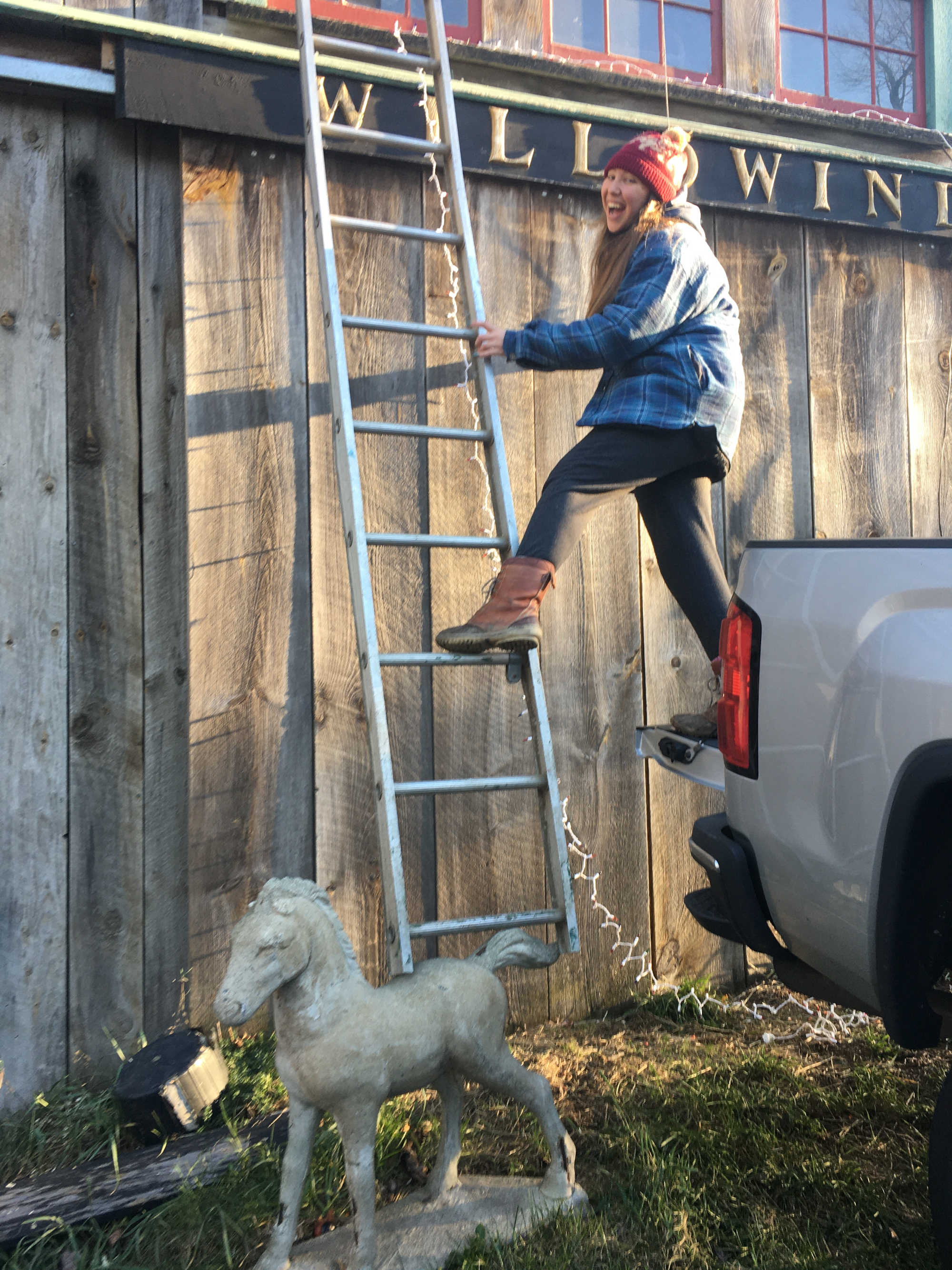 Putting Willowind sign on barn